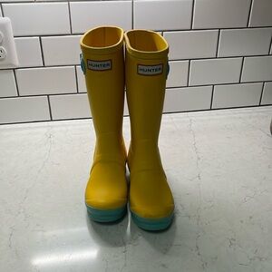 Hunter Boots for children. Unable to read size clearly but foot is  9”x 3”.